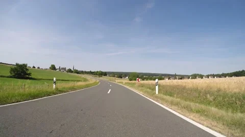 Drivers View on a rural road in summer (P.O.V.) Stock Footage 52494238