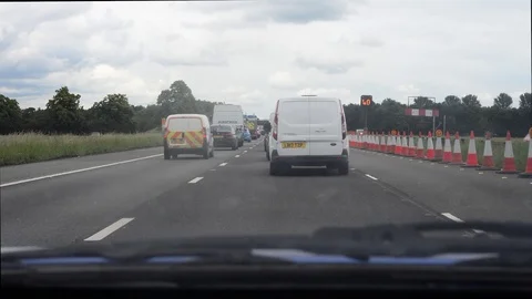 Drivers view traffic jam at roadworks on the M62 motorway Leeds uk Stock Footage 112692861