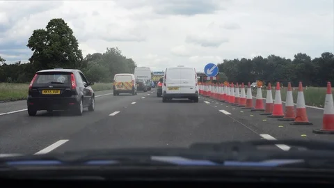 Drivers view traffic jam at roadworks on the M62 motorway Leeds uk Stock Footage 112694186