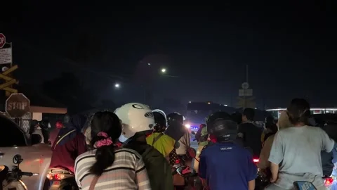 Drivers who obey traffic rules stop when a train passes Stock Footage 281042124