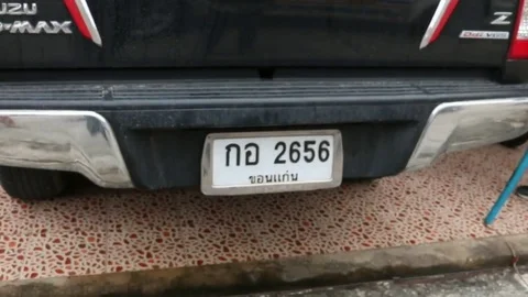 A drivers worst nightmare: python caught hiding under pick-up truck Stock Footage 109395489