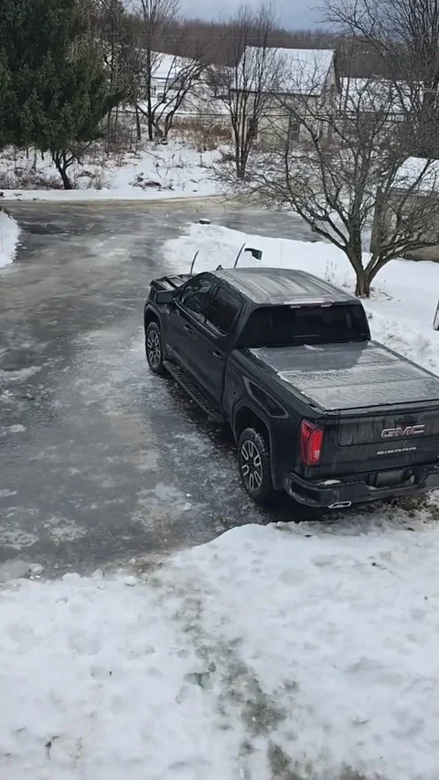Driveway Ice Slide Takes an Unexpected Detour, Sharbot Lake, Ontario, Canada - 2 Stock Footage 325729874