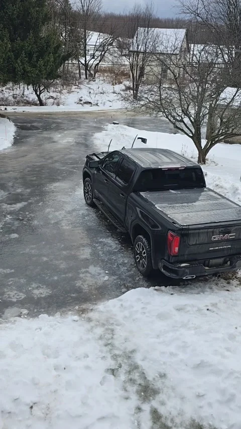 Driveway Ice Slide Takes an Unexpected Detour, Sharbot Lake, Ontario, Canada - 2 Stock Footage 325729875