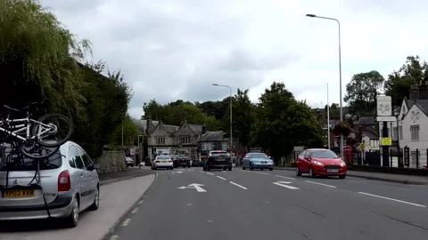 Driving A6 road through Disley village in Cheshire Vídeo Stock 168370246