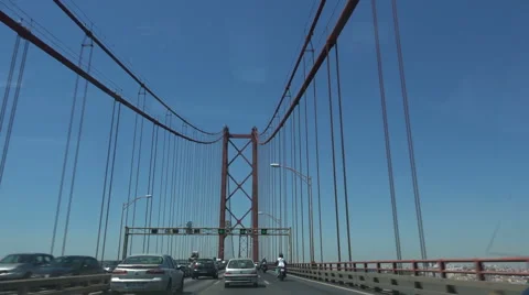 Driving accros the Ponte 25 de Abril bridge in Lisbon Portugal. Stock Footage 65809231