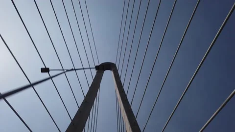 Driving across and looking up at structure and cables of Thu Thiem Two Stock Footage 228668904