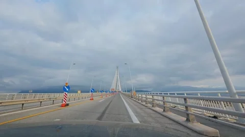 Driving across bridge in cloudy weather Stock Footage 309323765