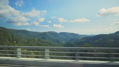 Driving across a bridge overlooking a beautiful mountain forest Video stock 341682011