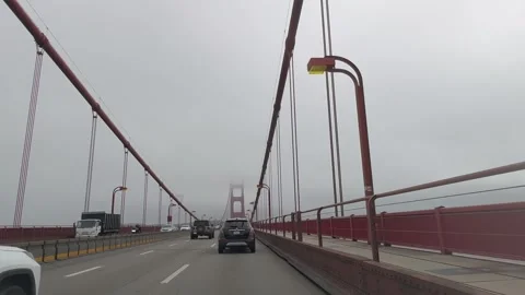 Driving across the Golden Gate Bridge on a foggy day. Parts of the Golden Gate Stock Footage 299203769
