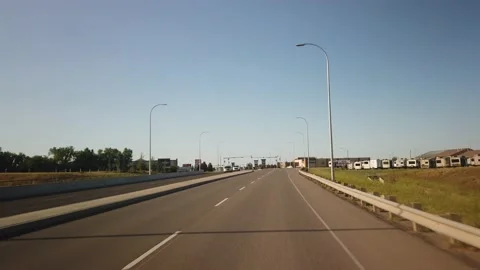 Driving across Lethbridge in Alberta during sunny summer day Stock Footage 146651177