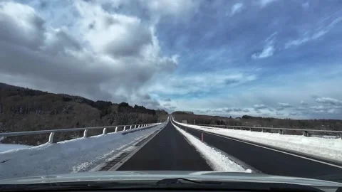 Driving across long bridge with traffic in Hokkaido Japan winter Video stock 333091483