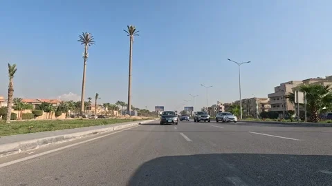Driving Across Open Modern Roads New Cairo Showing Buildings Traffic Vehicles Vidéo 329867582