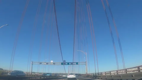 Driving across the Ponte 25 de Abril bridge in Lisbon Portugal Stock Footage 164611075