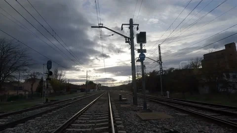 Driving across the train tracks in the afternoon Stock Footage 222009302