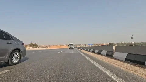 Driving Along Cairo Ring Road Highways Real Traffic and Expansive City Views Stock Footage 329836666
