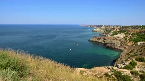 Driving along the edge of the mountain with a beautiful view of the sea Stock Footage 164559643