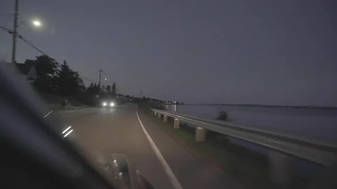 Driving Along A Harbor At Dusk Stock Footage 204766676