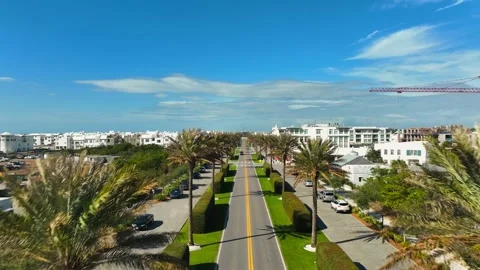 Driving along main road with beach town in the distance Stock Footage 239071833