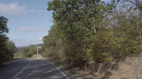 Driving along a mountain road. 動画素材 141837073