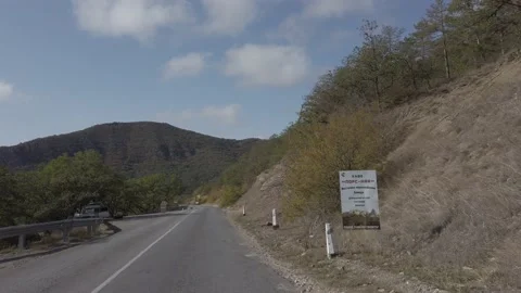 Driving along a mountain road. Video stock 141837116