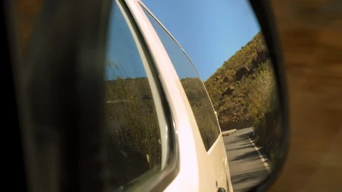 Driving Along the Mountainside Road from a Side Mirrors View 스톡 동영상 116559687