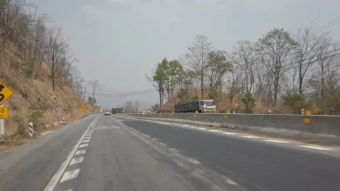 Driving along a mountine road while dry and smog season in Thailand. POV driving Stock Footage 137405818