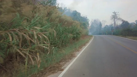 Driving along a mountine road while bushfire and smog season in Thailand. Point Stock Footage 138236172
