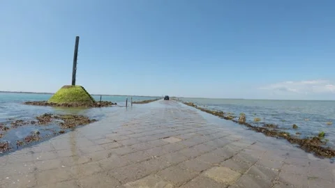Driving along the Passage du Gois with a POV on-board camera. Stock Footage 330247771
