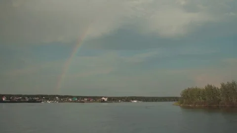 Driving along   River Seeing Rainbow On Sky Stock Footage 78156453