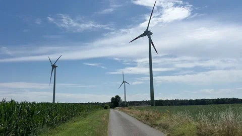Driving Along Rural Road with Wind Turbines, Wind Farm Landscape Stock Footage 339630847