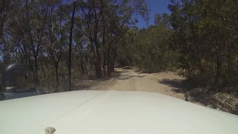 DRIVING ALONG SANDY TRACK THROUGH WINDOW Stock Footage 100519742