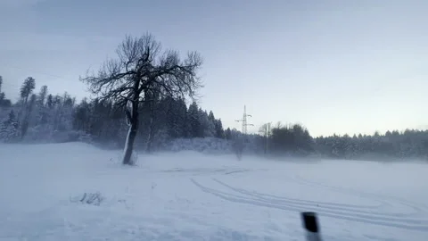 Driving along a snowy landscape Stock Footage 225675306