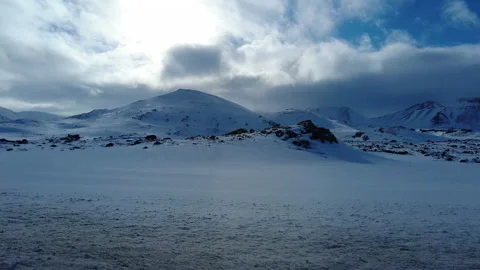 Driving along Snowy Mountains at Ring Road in Iceland near Reykjavik Stock Footage 230765605