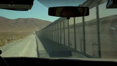 Driving Along The US Mexico Border Wall Video stock 97614156