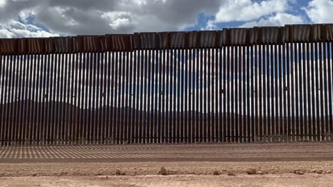 Driving along U.S. - Mexico Border Wall 2021 4K Stock Footage 148563206