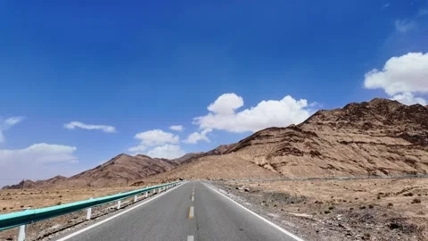 Driving along a winding mountain road in the Pamir Plateau Stock Footage 342510868