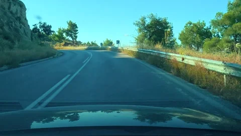 Driving along winding road through scenic countryside. Chalkidiki, Greece Stockbeeldmateriaal 339024732