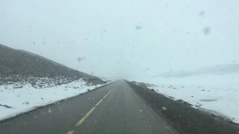 Driving along a winter road Video stock 239989943