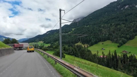 Driving Alongside Railway Tracks with Alpine Pastures Video stock 341365956