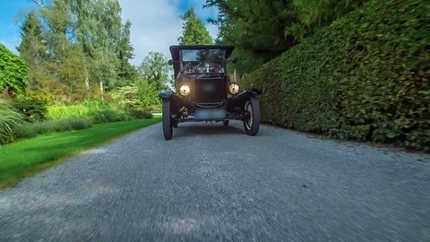 Driving with American oldtimer along nicely shaped hedge Video stock 83419613