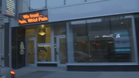 Driving And Passing Local Shops And Stores Stock Footage 118615768