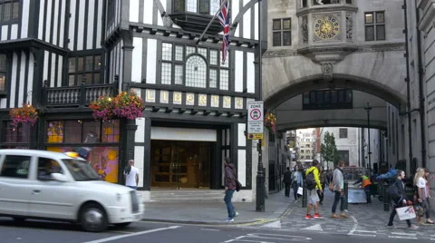 Driving and walking by the Liberty shopping mall in London Stock Footage