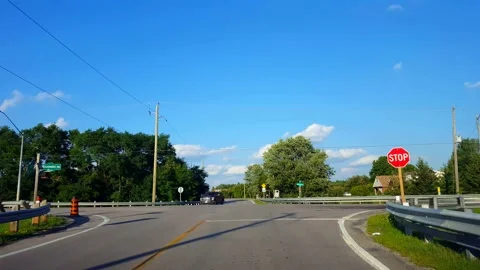 Driving Approaching Rural Stop Sign, Stopping, and Turning Left Stock Footage 137422088