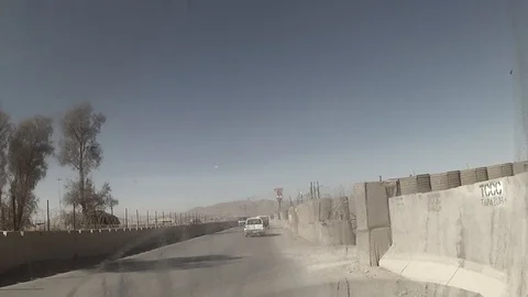 Driving around the forward operating base (FOB), Kandahar, Afghanistan. Stock Footage 100049453