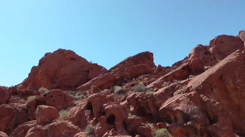 Driving around red wavy rocks of Valley of Fire State park, NE Stockbeeldmateriaal 60018720