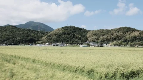 Driving Around Rice Fields Surrounded by Mountains in Japan on a Sunny Day Vídeos de archivo 94720687