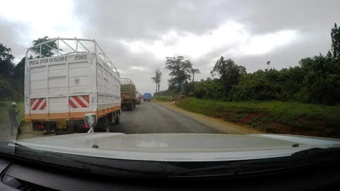 Driving around trucks and work vehicles in Africa Video stock 107184795