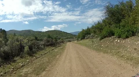 Driving ATV along mountain dirt road fast timelapse HD 016 Stock Footage 11970415