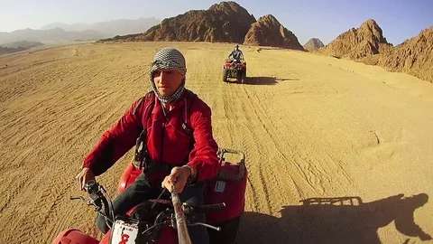 Driving ATVs in the Desert of Egypt Stock Footage 73606451