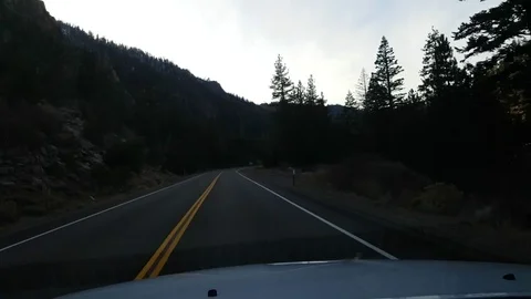 Driving in the autumn forest between mountains, on route 89, near lake taho.. Stock Footage 72418652